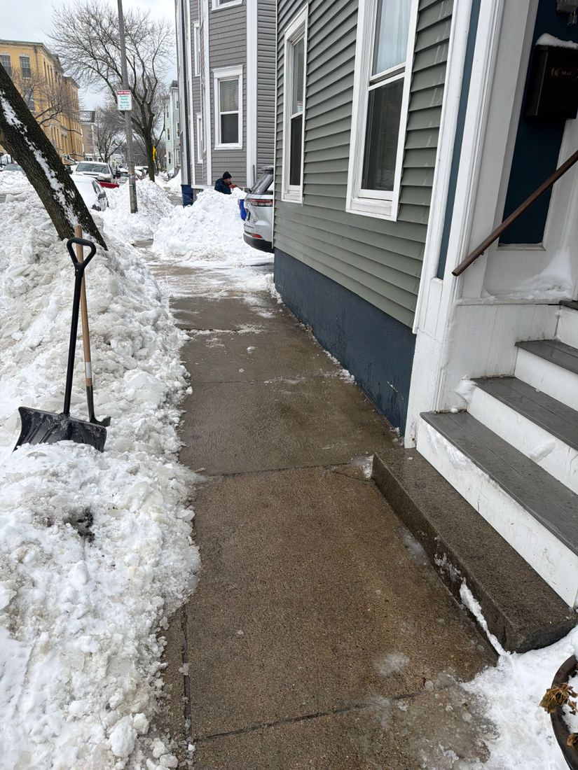 Cleared walkway and front stairs at a South Boston property