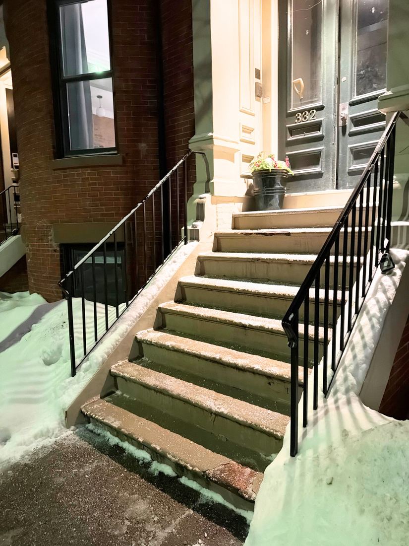 Cleared entry steps at a South Boston home after an evening storm